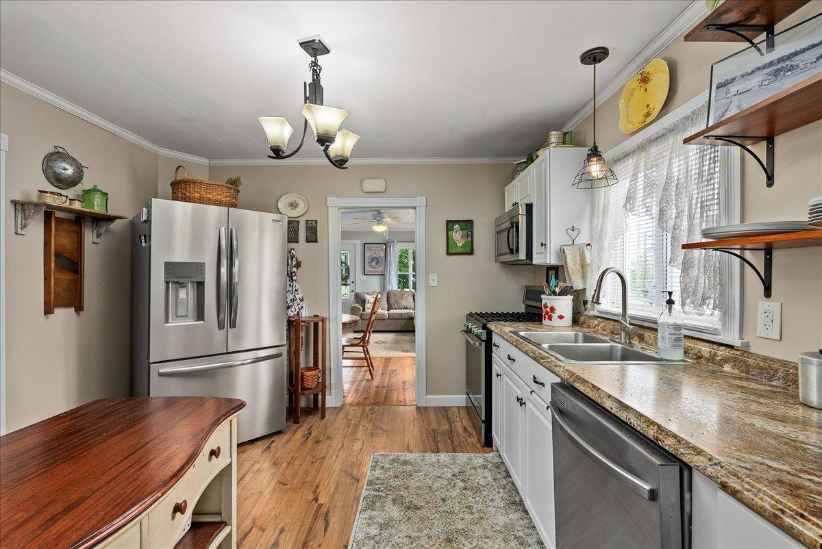454 Dooms Crossing Road Waynesboro, VA 22980 - Photo 8 of 35 a kitchen with stainless steel appliances granite countertop a sink stove and refrigerator