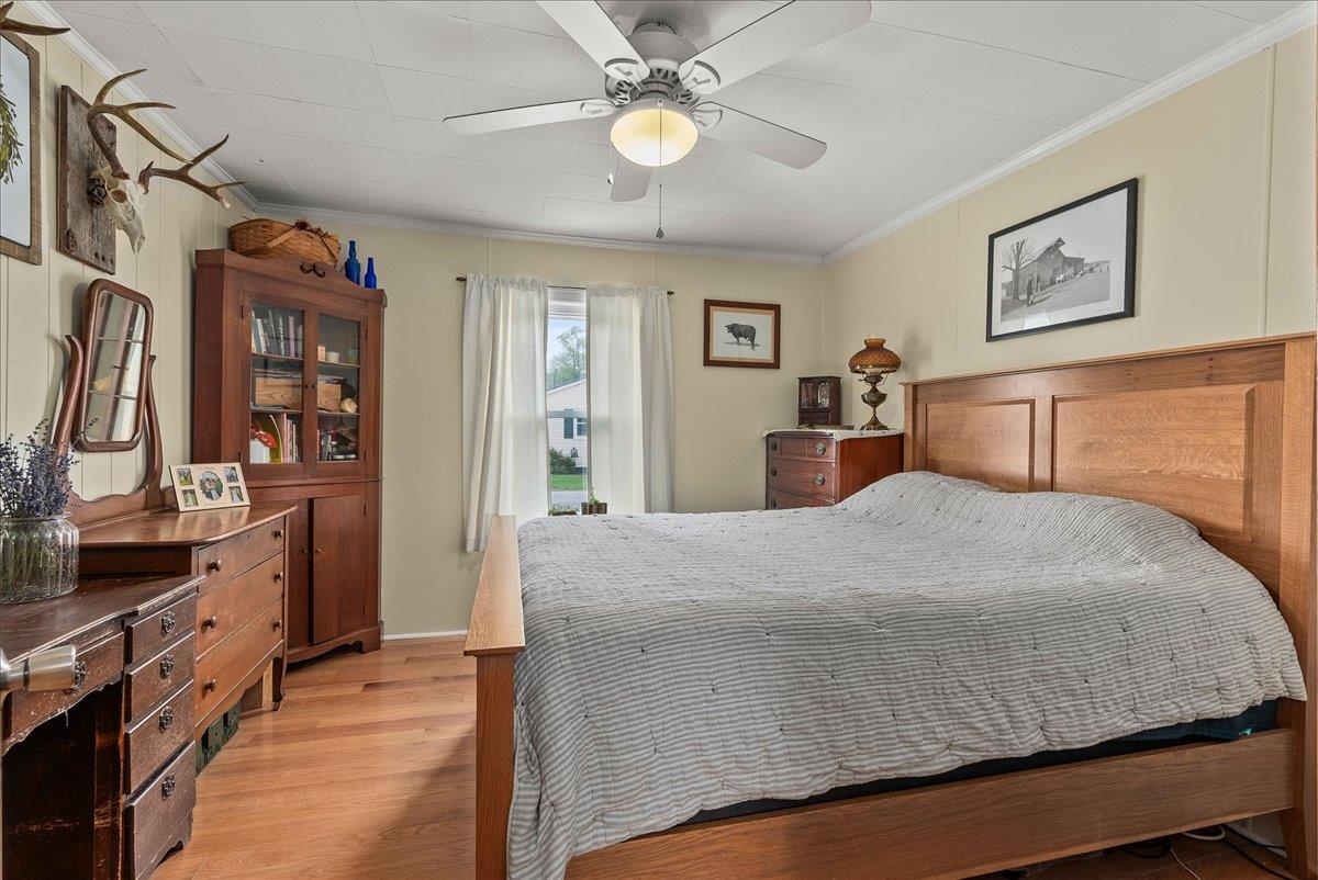 454 Dooms Crossing Road Waynesboro, VA 22980 - Photo 9 of 35 a bedroom with a bed and wooden floor