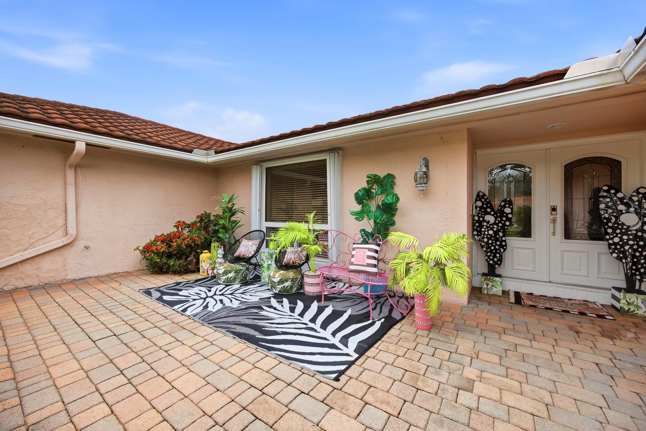 375 Northwest 53rd Street Boca Raton, FL 33487 - Photo 4 of 14 a front view of a house