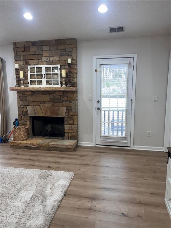 1003 Rolling Ridge Lane Auburn, GA 30011 - Photo 12 of 36 a view of an empty room with wooden floor and a window