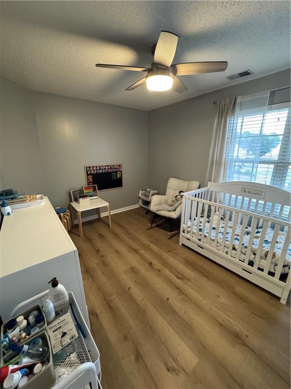 1003 Rolling Ridge Lane Auburn, GA 30011 - Photo 21 of 36 a bedroom with furniture and a window