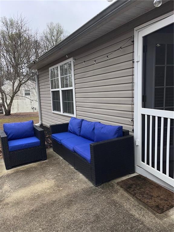 1003 Rolling Ridge Lane Auburn, GA 30011 - Photo 31 of 36 a view of a two chairs in the patio