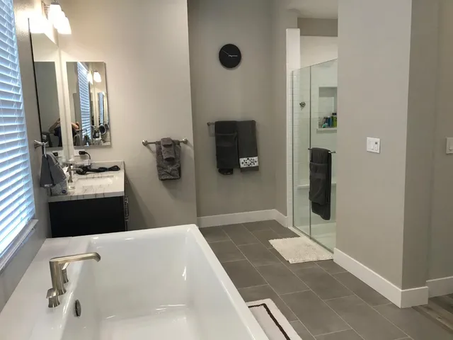 a bathroom with a bathtub and a sink
