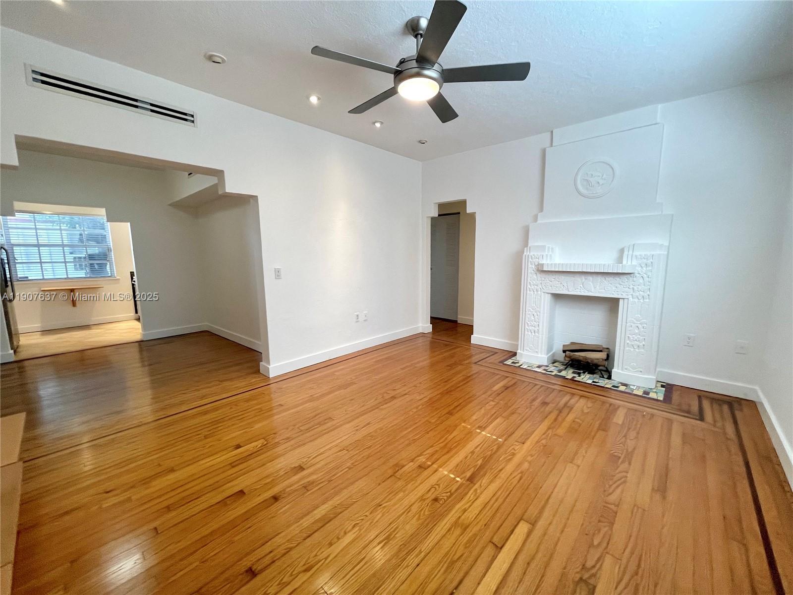 1307 Euclid Avenue, Unit 2 Miami Beach, FL 33139 - Photo 2 of 13 a view of an empty room and wooden floor
