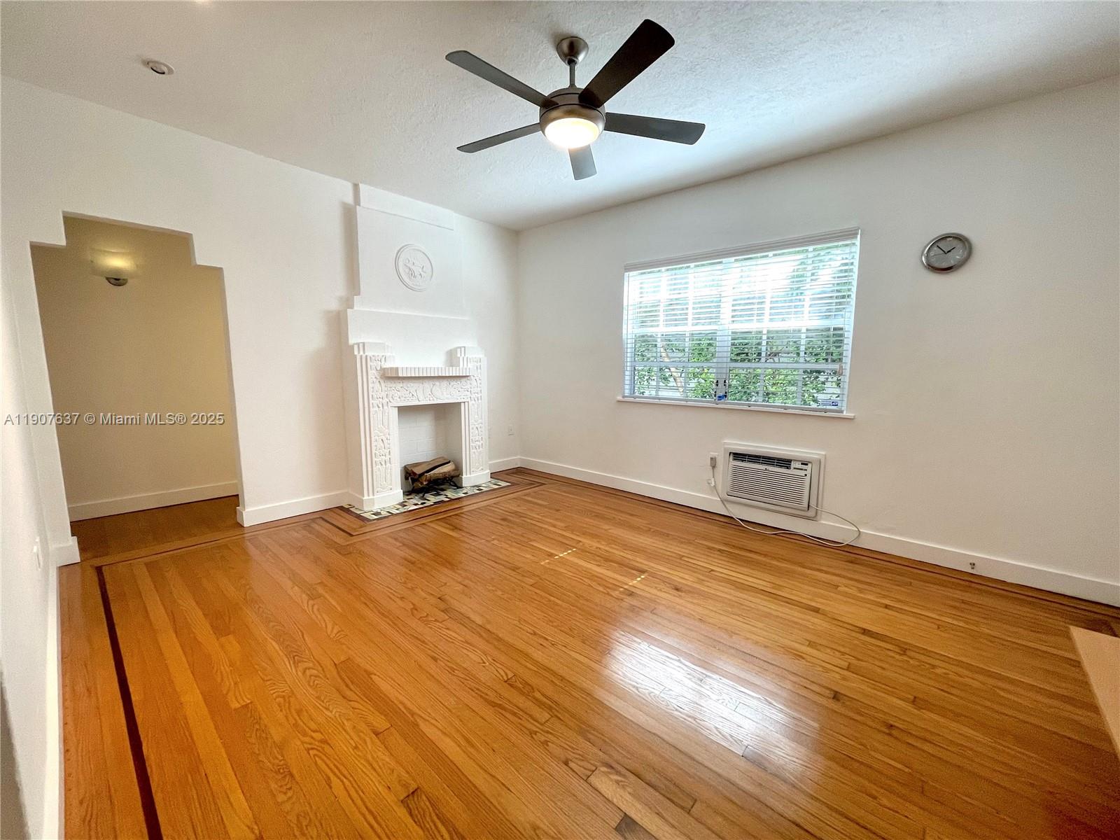 1307 Euclid Avenue, Unit 2 Miami Beach, FL 33139 - Photo 3 of 13 a view of empty room with wooden floor and fan