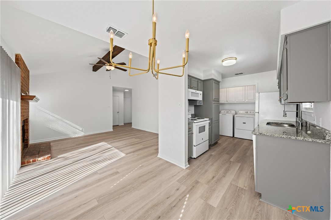 2313 Paul Revere Street, Unit A Temple, TX 76504 - Photo 12 of 22 a kitchen with a refrigerator and a sink
