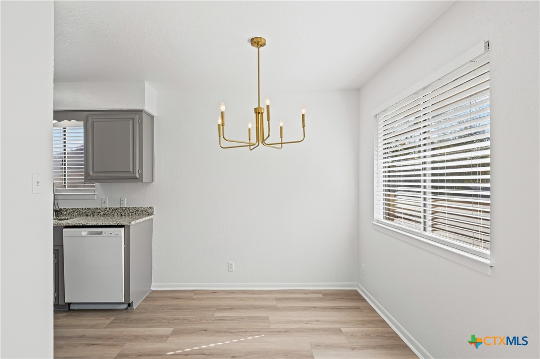 2313 Paul Revere Street, Unit A Temple, TX 76504 - Photo 6 of 22 a view of empty room with wooden floor and window