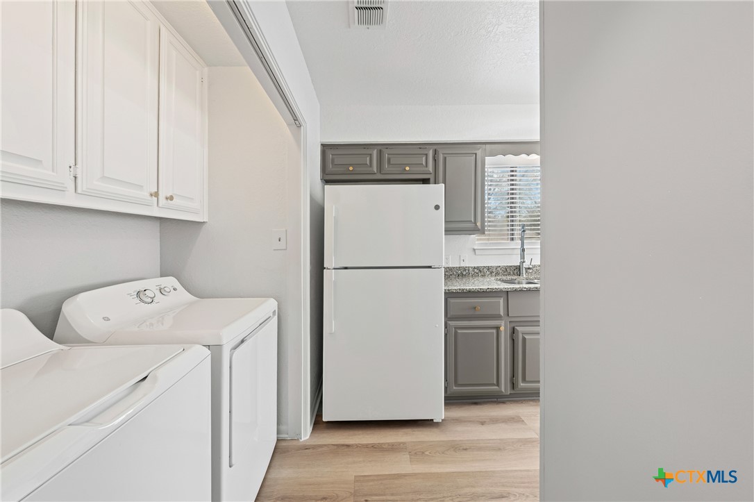 2313 Paul Revere Street, Unit A Temple, TX 76504 - Photo 9 of 22 a utility room with dryer and washer
