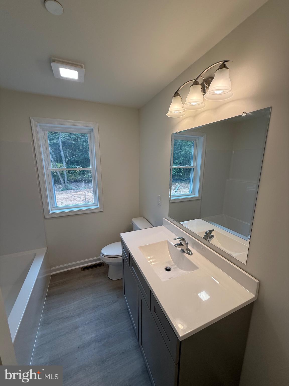26994 Branchtown Road Worton, MD 21678 - Photo 12 of 24 a bathroom with a sink vanity and a mirror