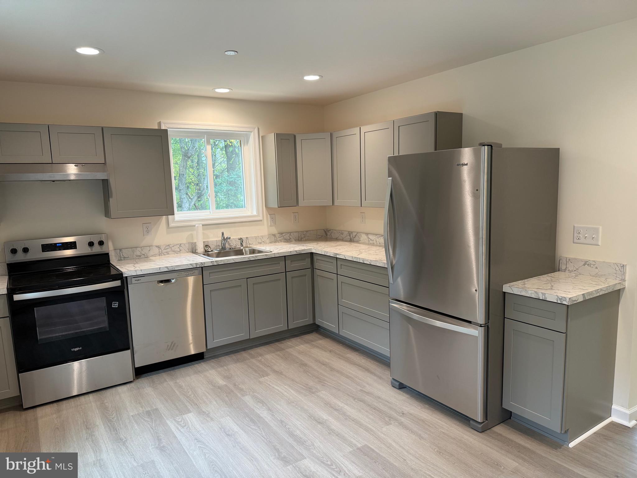 26994 Branchtown Road Worton, MD 21678 - Photo 8 of 24 a kitchen with a refrigerator sink and stove