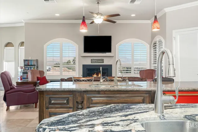 a living room with fireplace furniture and a flat screen tv