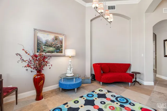 a kitchen with stainless steel appliances kitchen island granite countertop a table and chairs in it