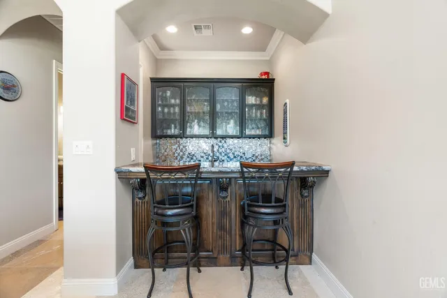 a room with pool table and flat screen tv