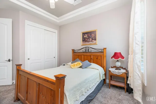 a bathroom with a granite countertop sink mirror and vanity