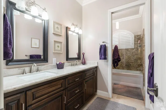 a bed room with a bed and a ceiling fan