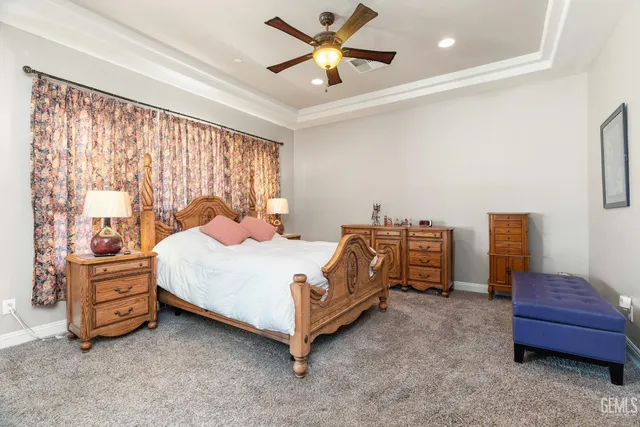 a bedroom with a bed and a flat tv screen