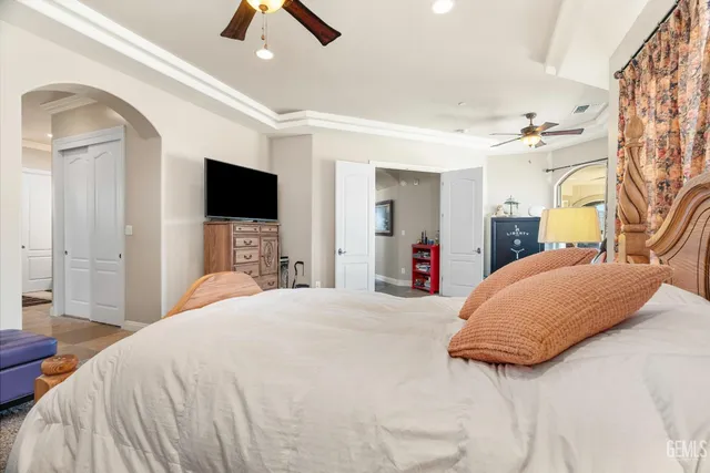 a bathroom with a granite countertop sink a mirror and a shower