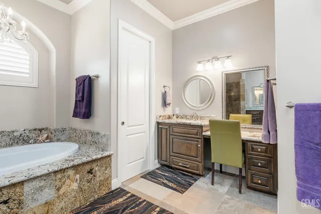 a living room with lots of furniture and a large window