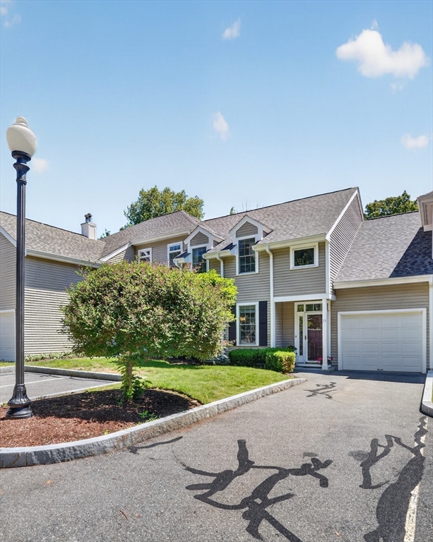 15 Evergreen Circle, Unit 15 Canton, MA 02021 - Photo 3 of 29 a house view with a garden space