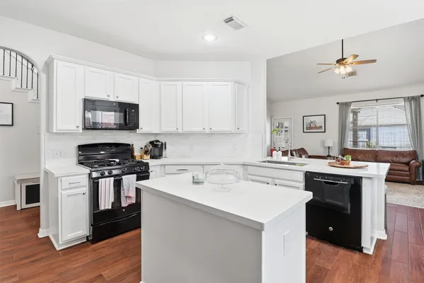 a kitchen with a stove and a microwave