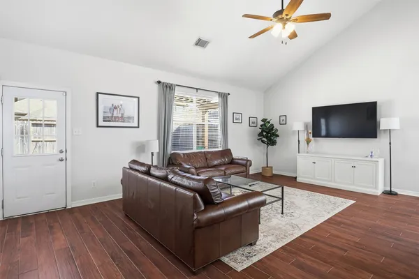 a living room with furniture and a flat screen tv