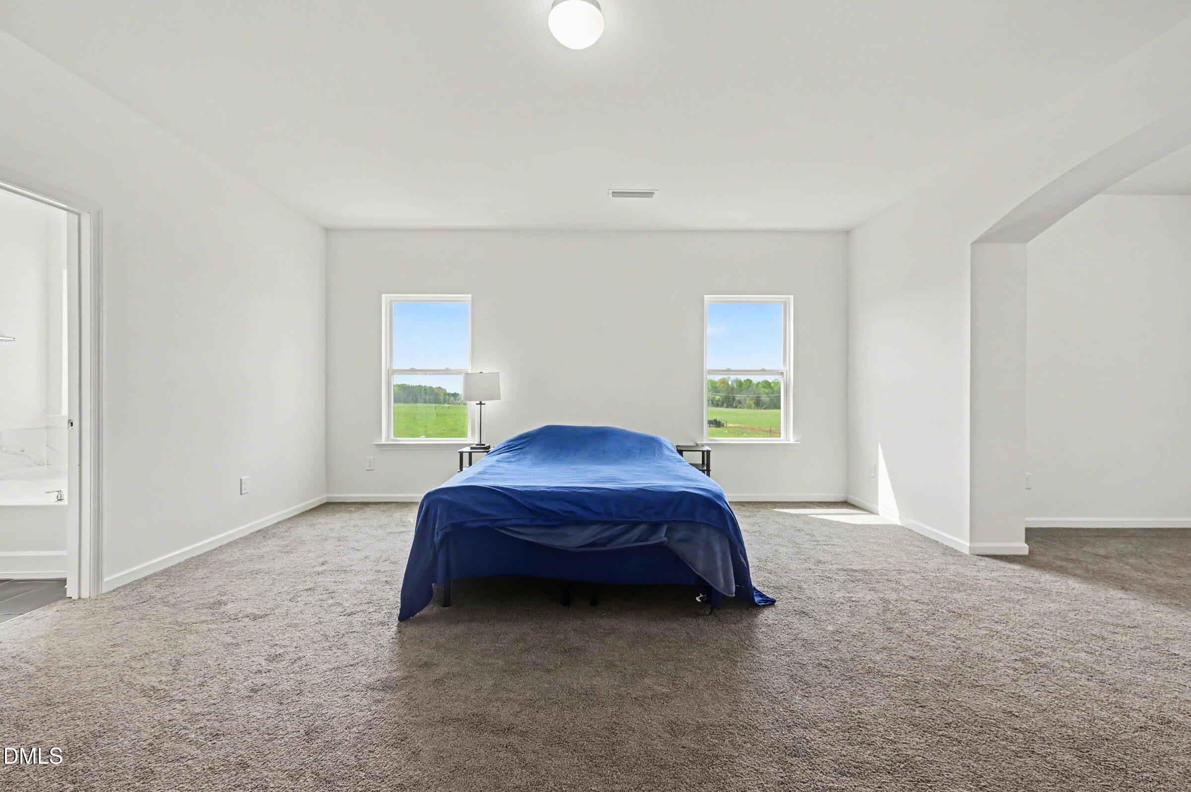 7015 Grainfield Road Mebane, NC 27302 - Photo 27 of 42 a bed room with a bed and a window