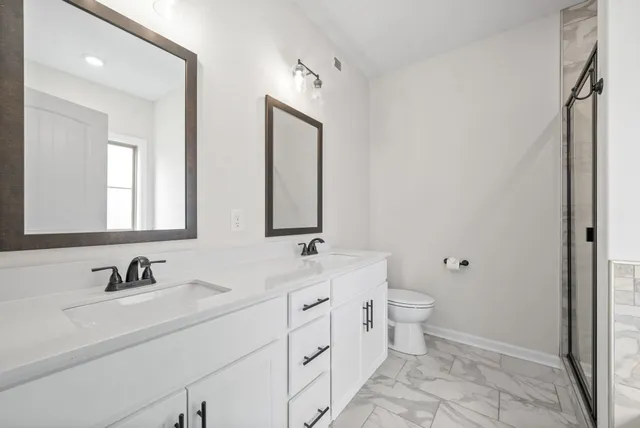 a white bath tub sitting in a bathroom next to a window