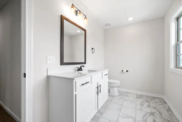 a view of a house with backyard and porch