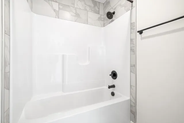 a view of a house with backyard and porch