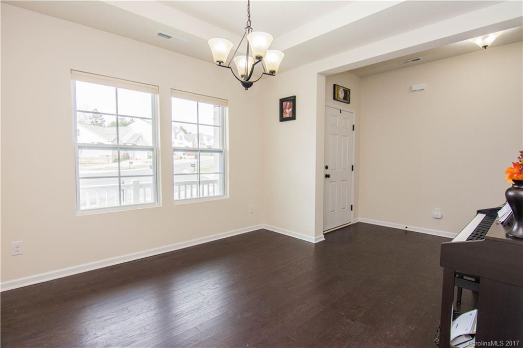 1689 Beleek Ridge Lane Clover, SC 29710 - Photo 12 of 24 a view of livingroom with window hardwood floor and ceiling fan