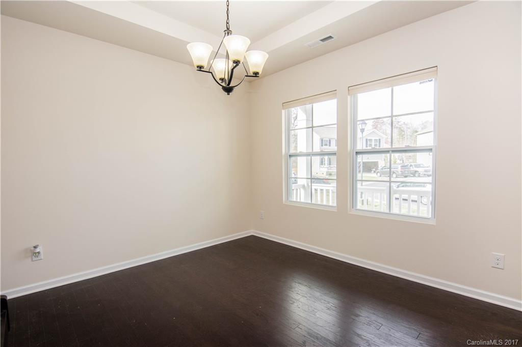 1689 Beleek Ridge Lane Clover, SC 29710 - Photo 13 of 24 an empty room with wooden floor and windows