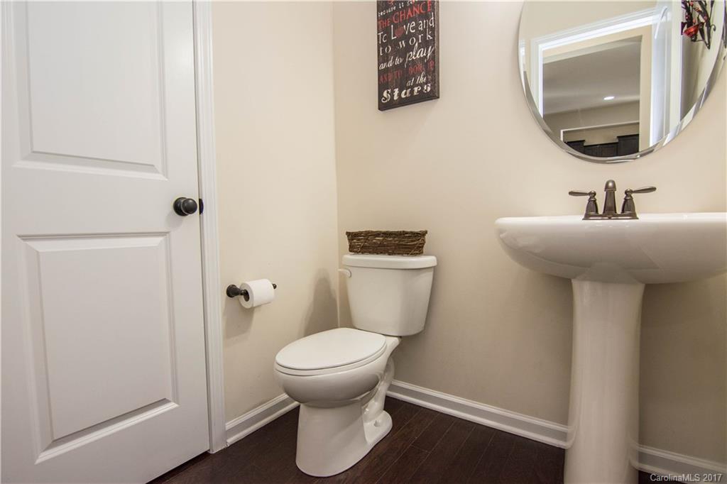 1689 Beleek Ridge Lane Clover, SC 29710 - Photo 14 of 24 a bathroom with a toilet sink and mirror