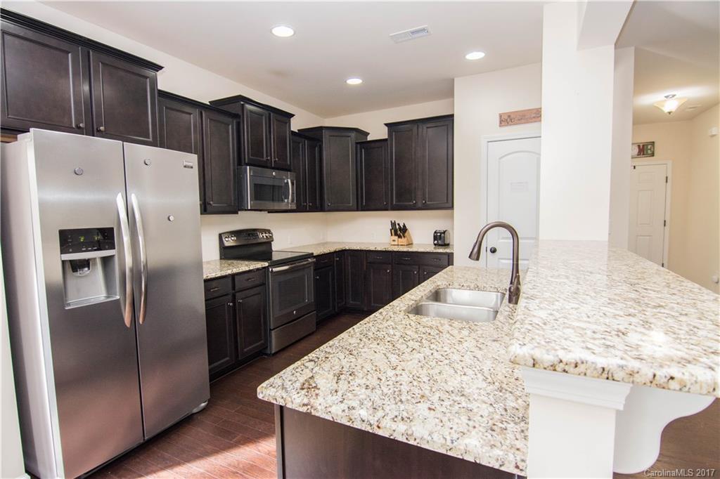 1689 Beleek Ridge Lane Clover, SC 29710 - Photo 3 of 24 a kitchen with stainless steel appliances granite countertop a refrigerator and a sink