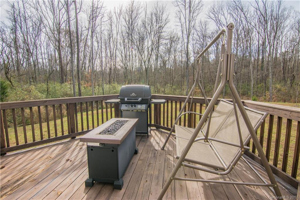 1689 Beleek Ridge Lane Clover, SC 29710 - Photo 23 of 24 a view of a balcony with wooden floor and outdoor seating
