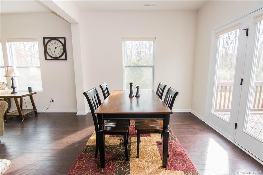 1689 Beleek Ridge Lane Clover, SC 29710 - Photo 6 of 24 a view of a dining room with furniture and wooden floor