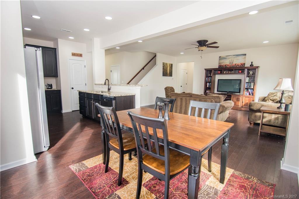1689 Beleek Ridge Lane Clover, SC 29710 - Photo 8 of 24 a view of a dining room with furniture and wooden floor