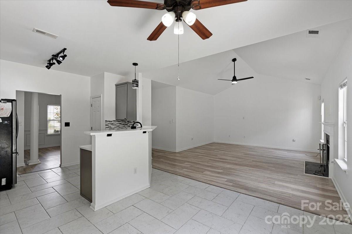 1007 Reigate Road Charlotte, NC 28262 - Photo 13 of 28 a view of kitchen with refrigerator and window