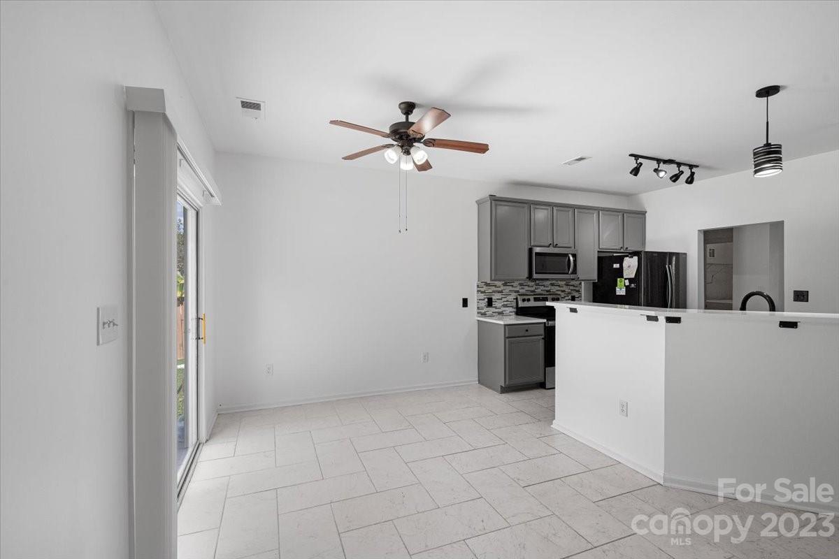1007 Reigate Road Charlotte, NC 28262 - Photo 14 of 28 a view of kitchen with cabinets and white appliances