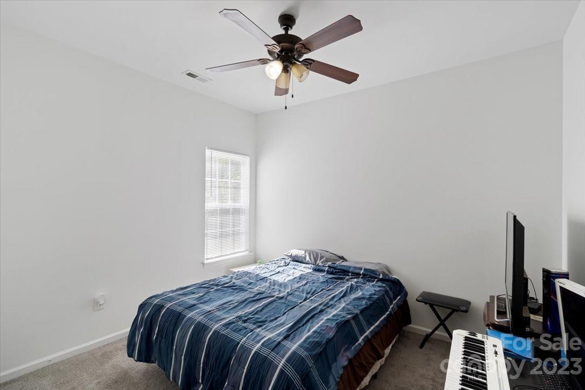 1007 Reigate Road Charlotte, NC 28262 - Photo 19 of 28 a bedroom with bed and a window