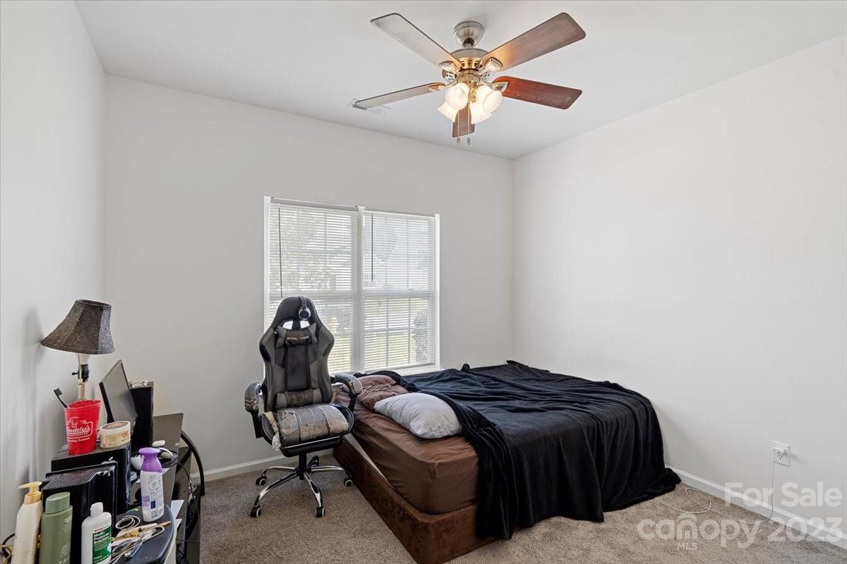 1007 Reigate Road Charlotte, NC 28262 - Photo 21 of 28 a bedroom with a bed and a window