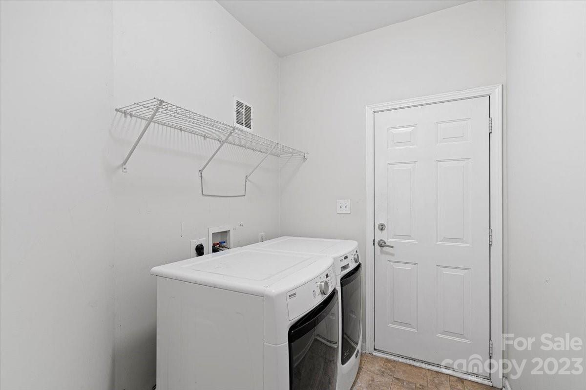 1007 Reigate Road Charlotte, NC 28262 - Photo 23 of 28 a utility room with dryer and washer