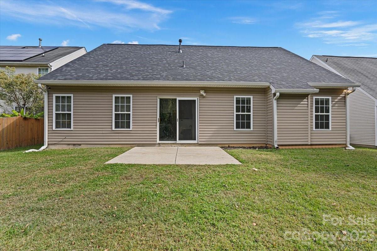 1007 Reigate Road Charlotte, NC 28262 - Photo 4 of 28 a front view of a house with a yard