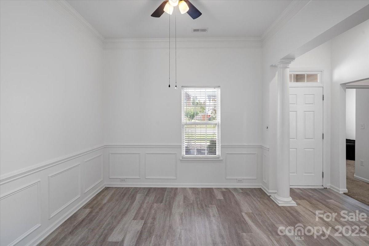 1007 Reigate Road Charlotte, NC 28262 - Photo 7 of 28 wooden floor in an empty room with a window