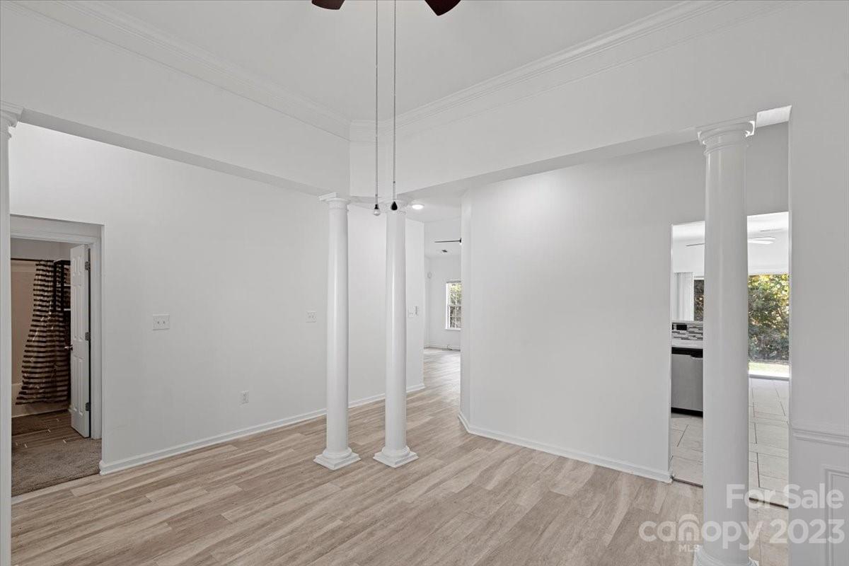 1007 Reigate Road Charlotte, NC 28262 - Photo 9 of 28 a view of an empty room with wooden floor