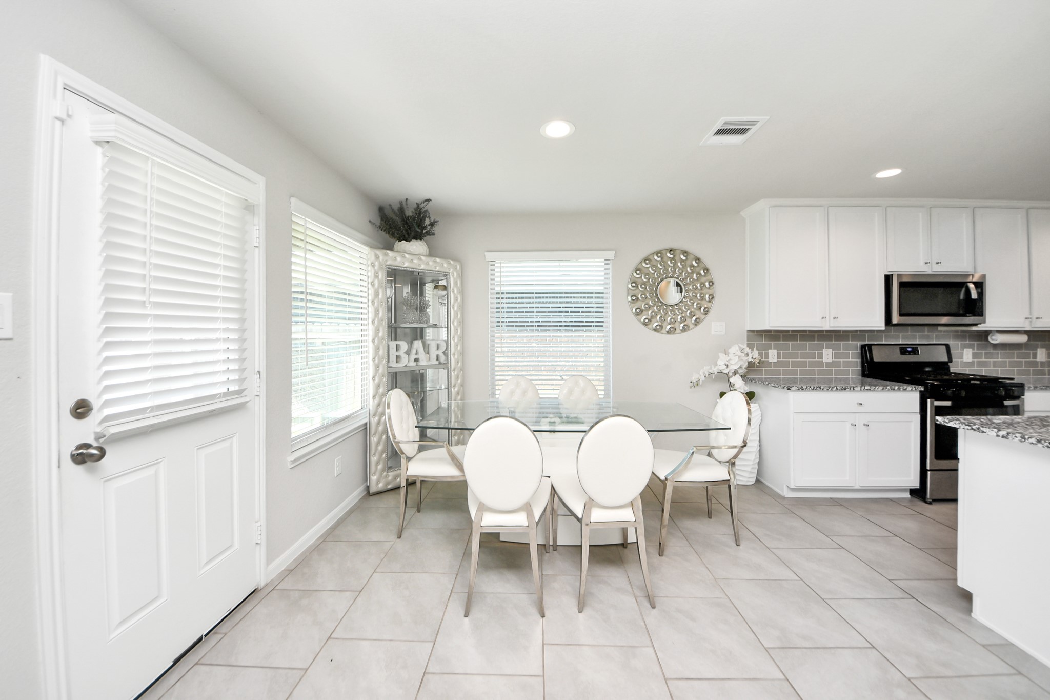 3514 Windham Way Katy, TX 77494 - Photo 22 of 42 a dining room with furniture and a window