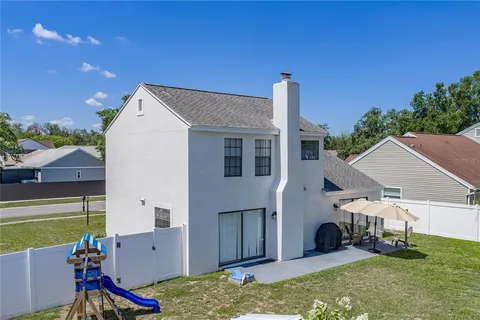 a front view of a house with a yard and a garage
