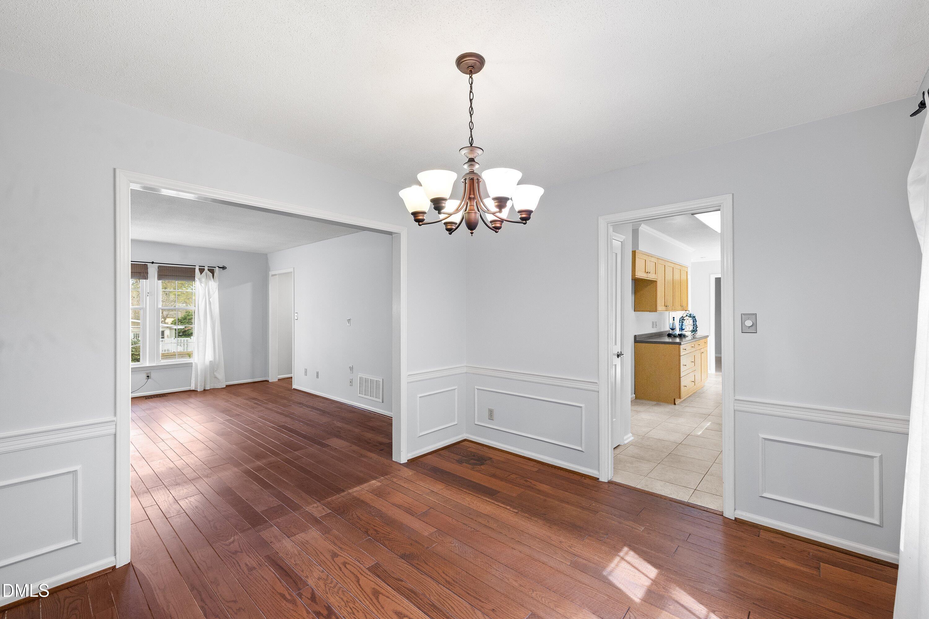 400 Cedar Hill Lane Raleigh, NC 27609 - Photo 11 of 41 a view of livingroom with hardwood floor and kitchen view