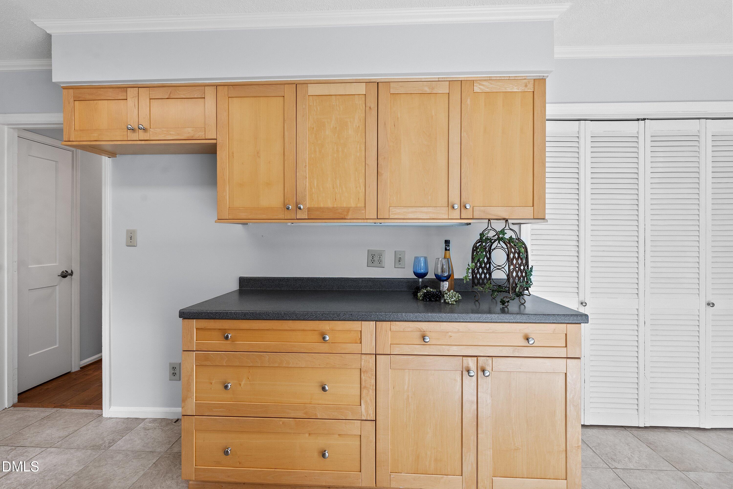 400 Cedar Hill Lane Raleigh, NC 27609 - Photo 18 of 41 a kitchen with granite countertop cabinets and window