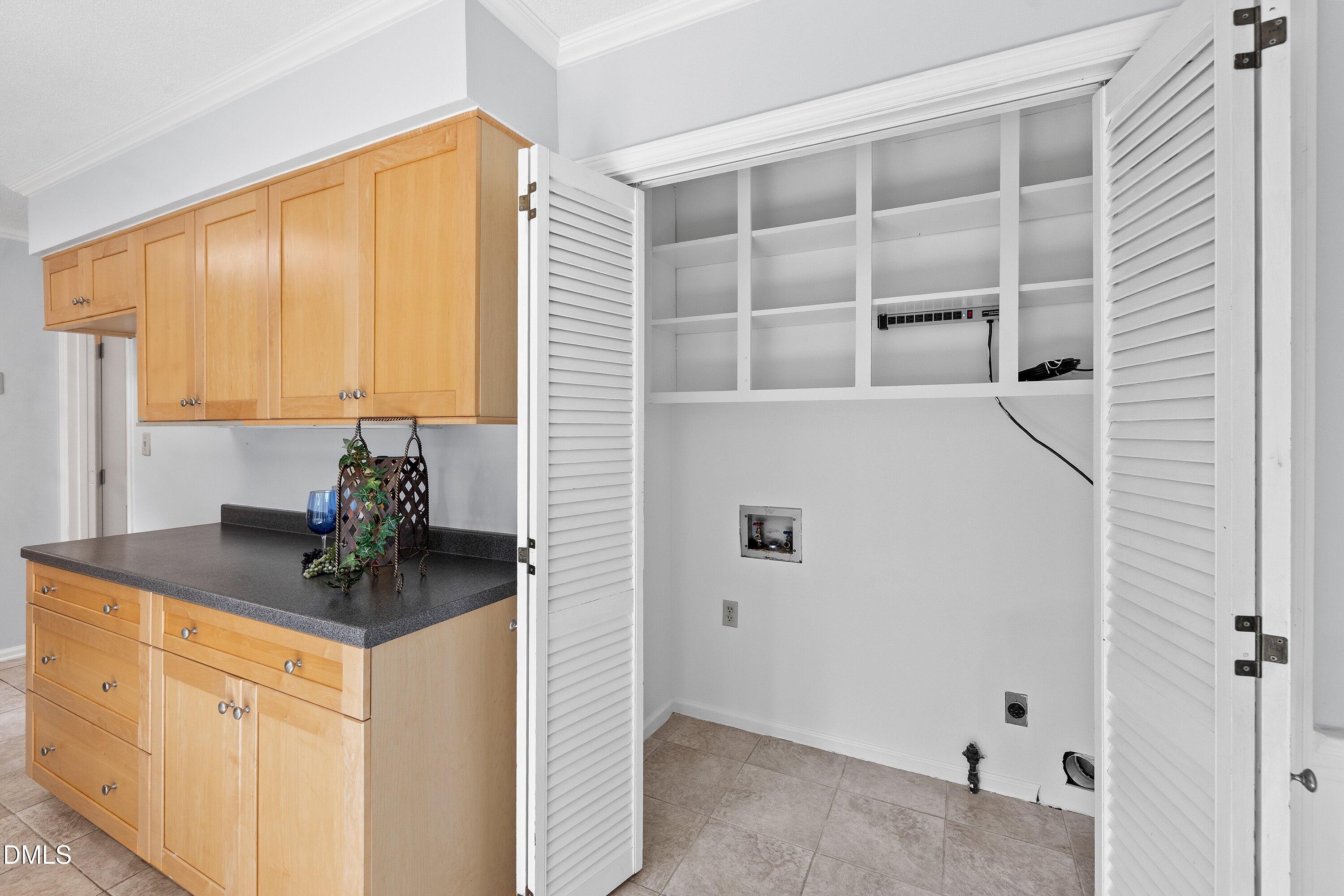 400 Cedar Hill Lane Raleigh, NC 27609 - Photo 20 of 41 a kitchen with a cabinets and window