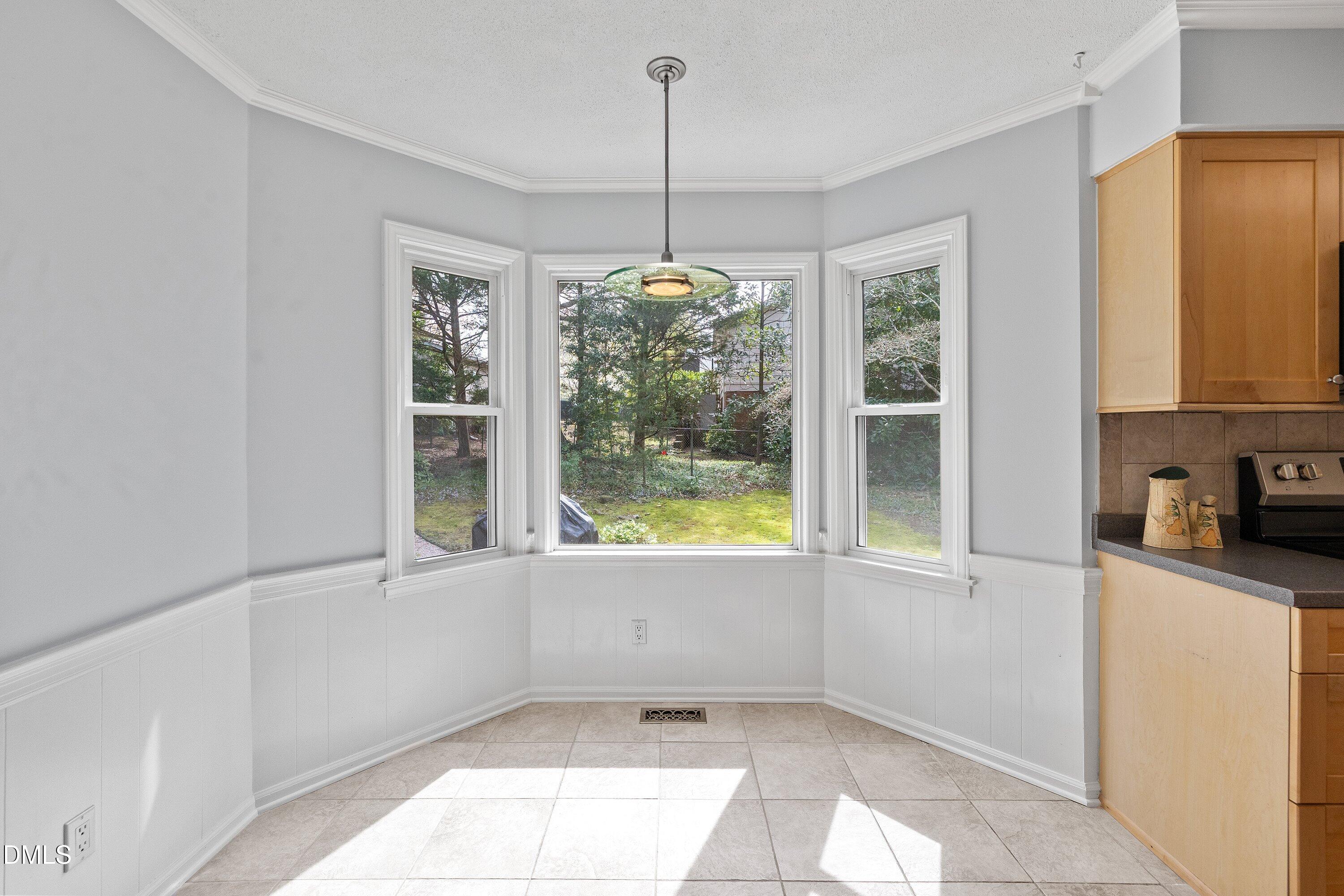 400 Cedar Hill Lane Raleigh, NC 27609 - Photo 21 of 41 a kitchen with windows and refrigerator